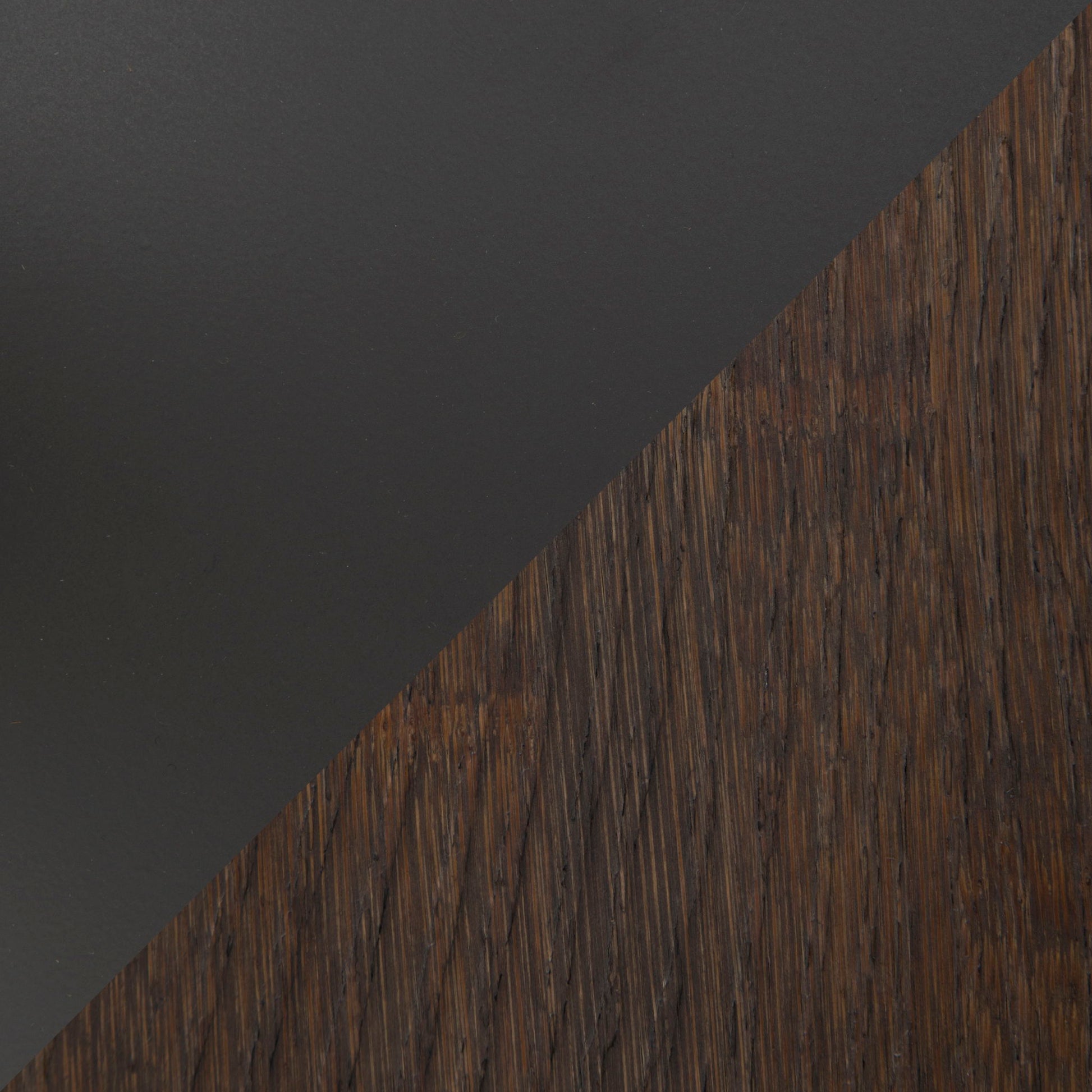 A diagonal split image displays the Dakota - Industrial Adjustable Bar Dinette Table: matte black surface on the top left, and textured dark brown wood on the bottom right.