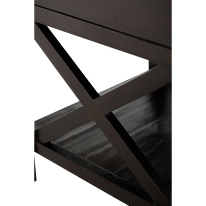 Close-up of the Kitchener - Handcrafted Table: features a dark wooden surface and an intersecting X-shaped support, shown against a white background.