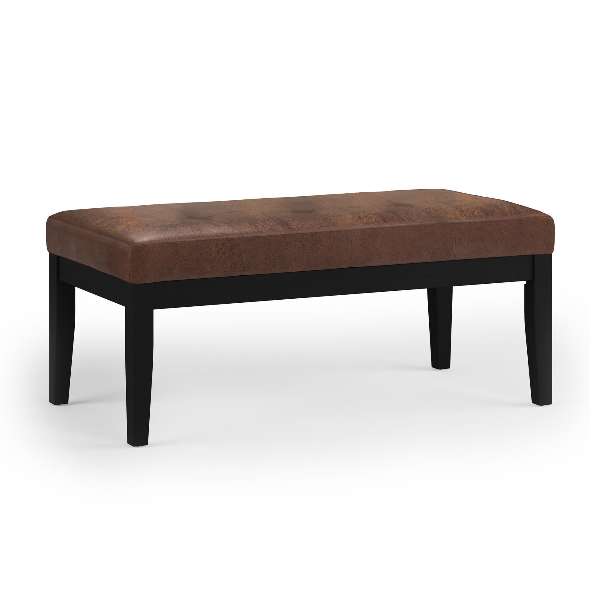 The Lacey Upholstered Tufted Ottoman Bench features a brown leather cushion and four black wooden legs, presented against a white background.
