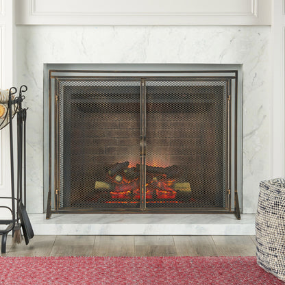 A modern fireplace features burning logs, a marble surround, and the Samantha - Iron Fireplace Screen 2 Door Design. Fireplace tools are on the left, a red rug lies in front, and a textured pouf is on the right.