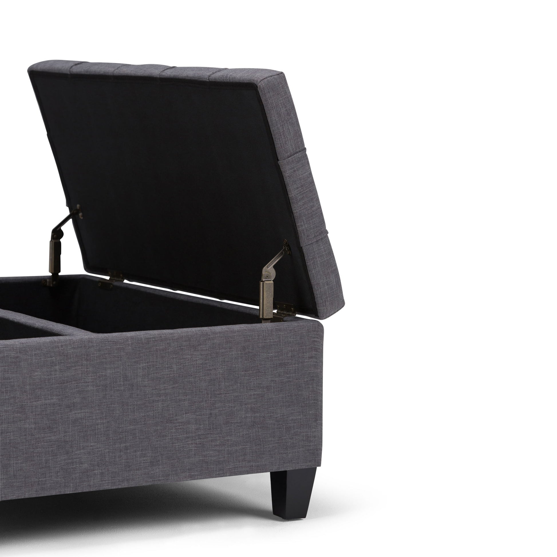 The Harrison Upholstered Coffee Table Storage Ottoman, shown in gray with a hinged lid open to reveal interior storage, features short black legs and is displayed against a white background.