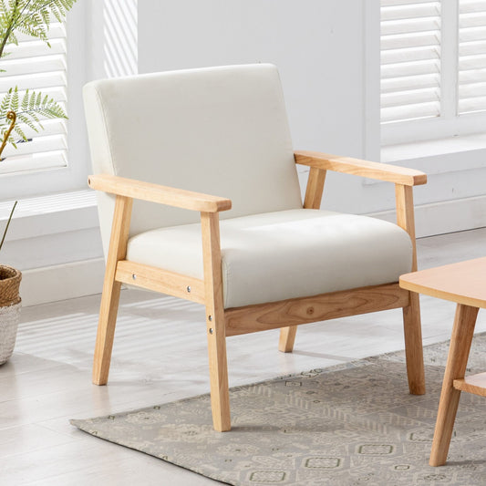 The Bahamas - Linen Fabric Chair, featuring a light wood frame and white cushioned seat and backrest, is placed on a patterned rug in a bright room with large windows, white walls, and a potted plant.