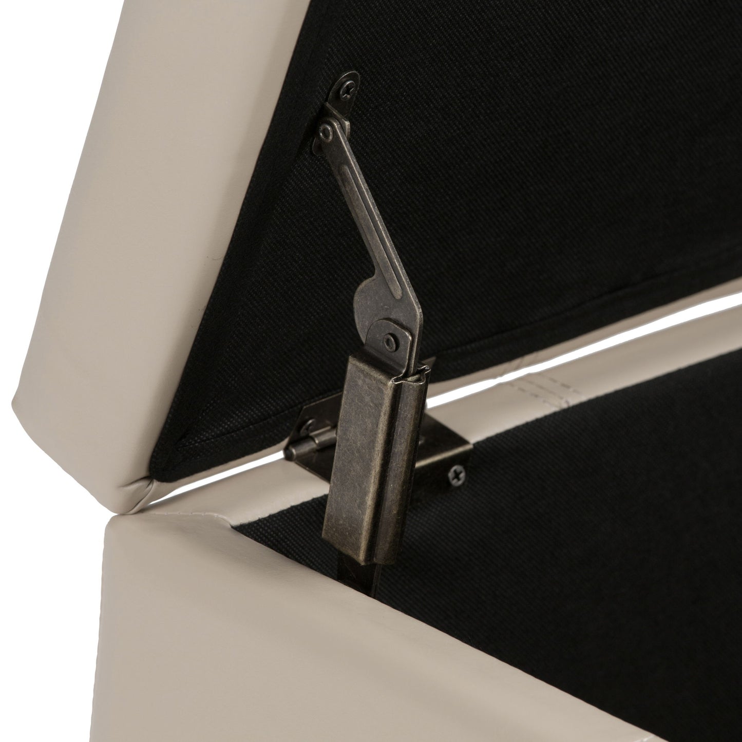 Close-up of the metallic hinge inside the Dover - Upholstered Storage Ottoman Bench, shown with the beige lid partially open to reveal its black interior lining.
