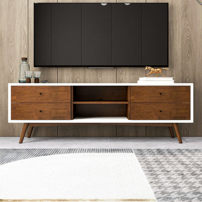 The Caroline - Modern TV Stand Up To 72" features a sleek wooden design with white trim, four drawers, and open shelves. Positioned against a wood-paneled wall, it displays décor items below a wall-mounted flat-screen TV.