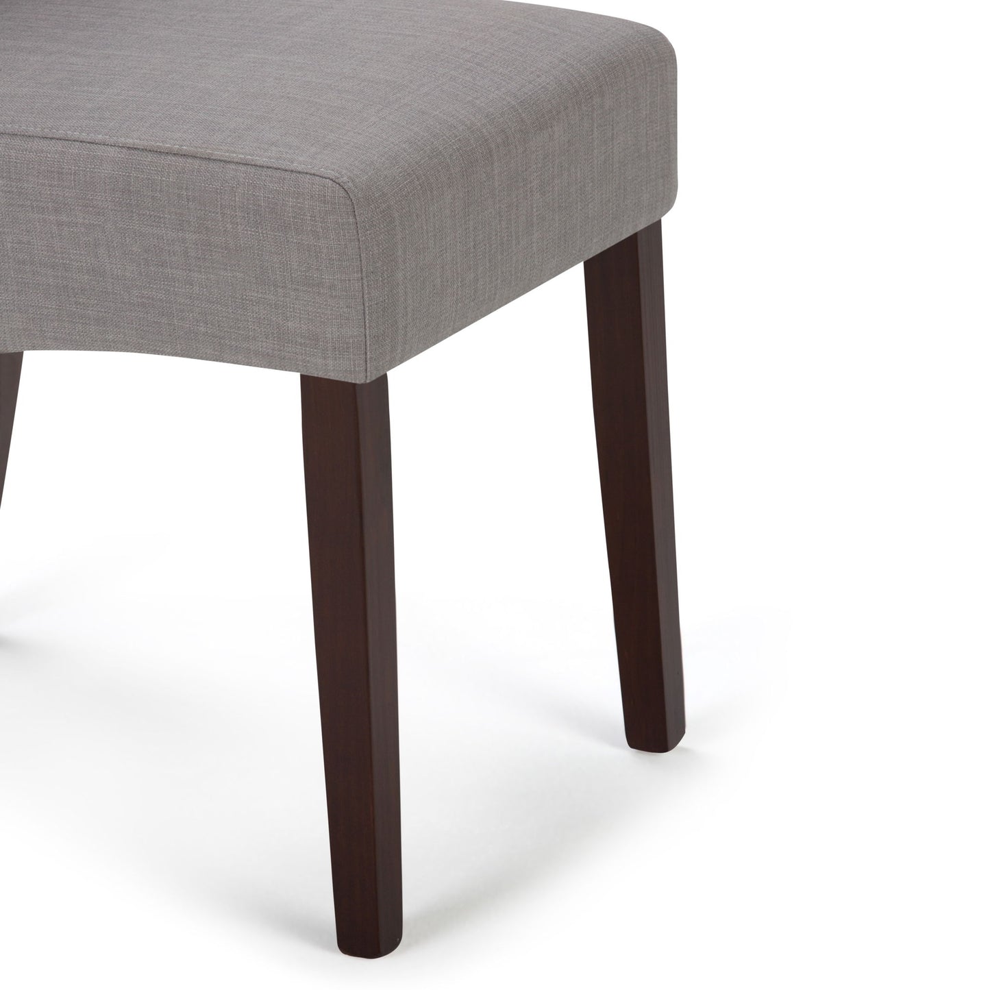 A close-up of the Avalon - Deluxe Parson Dining Chair set, featuring light gray upholstered seats and dark wooden legs, displayed against a white background.