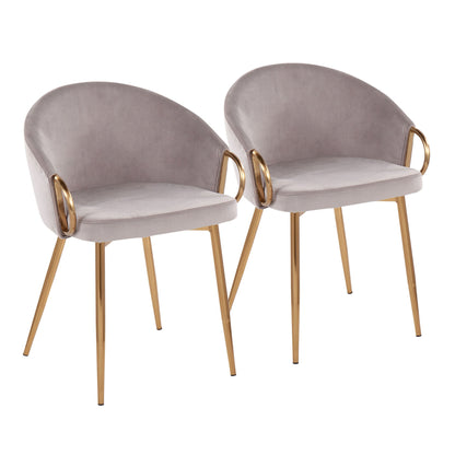Two Claire Contemporary Glam Chairs with light gray velvet upholstery, rounded backs, and gold metal legs and armrests are placed side by side against a white background.