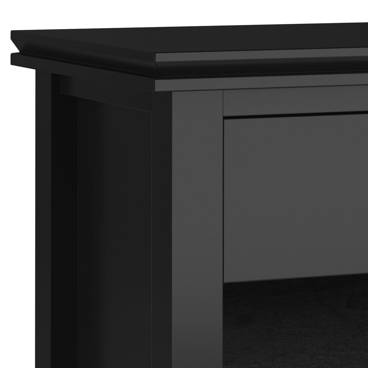 Close-up of the top corner of the Artisan - Handcrafted Bedside Table, featuring black wood with a smooth finish and decorative edging on the top panel.