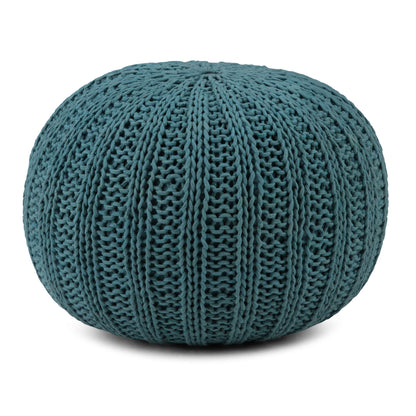 The Shelby Handcrafted Hand Knit Round Pouf features a chunky, ribbed knit texture in teal and is displayed against a white background.