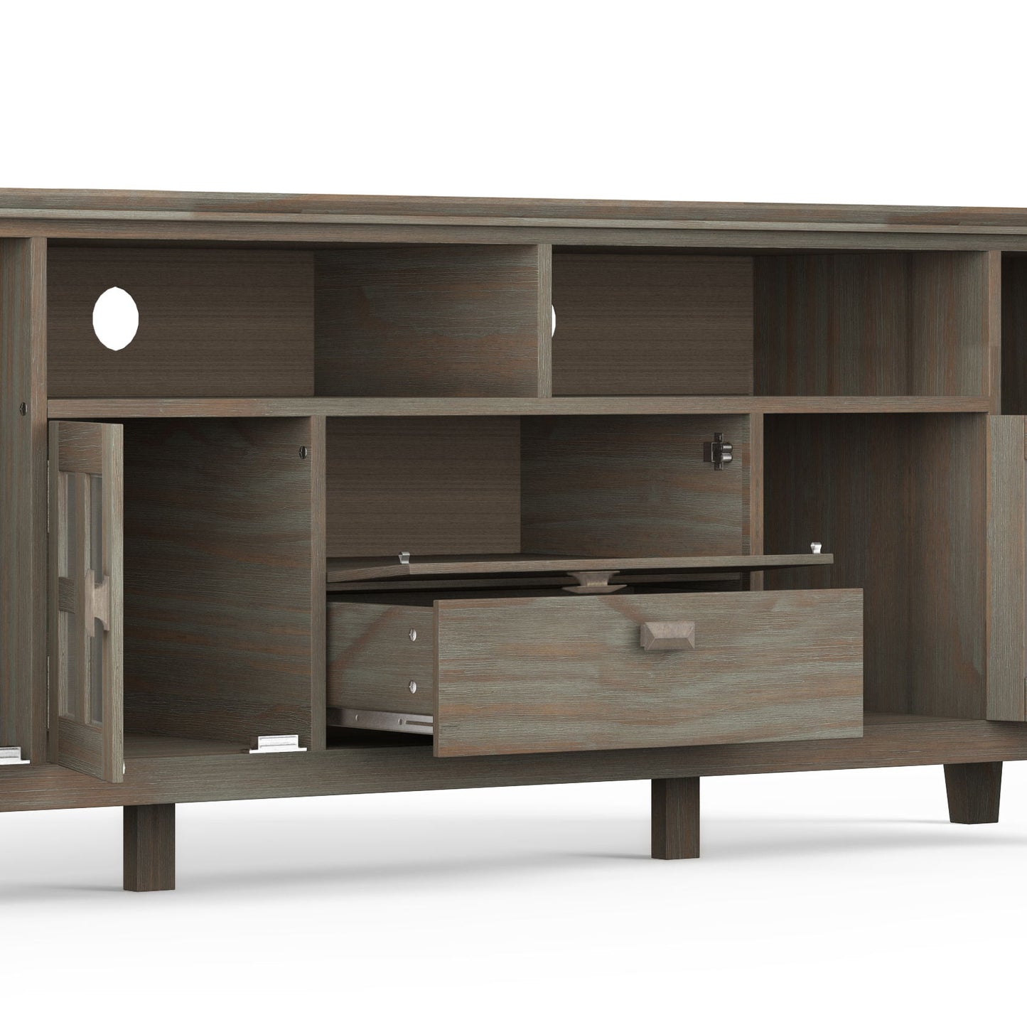 The Artisan - TV Media Stand features open shelves, a left-side cabinet door, a partially open central drawer, and cable management holes on the back. It sits on short legs against a white background.