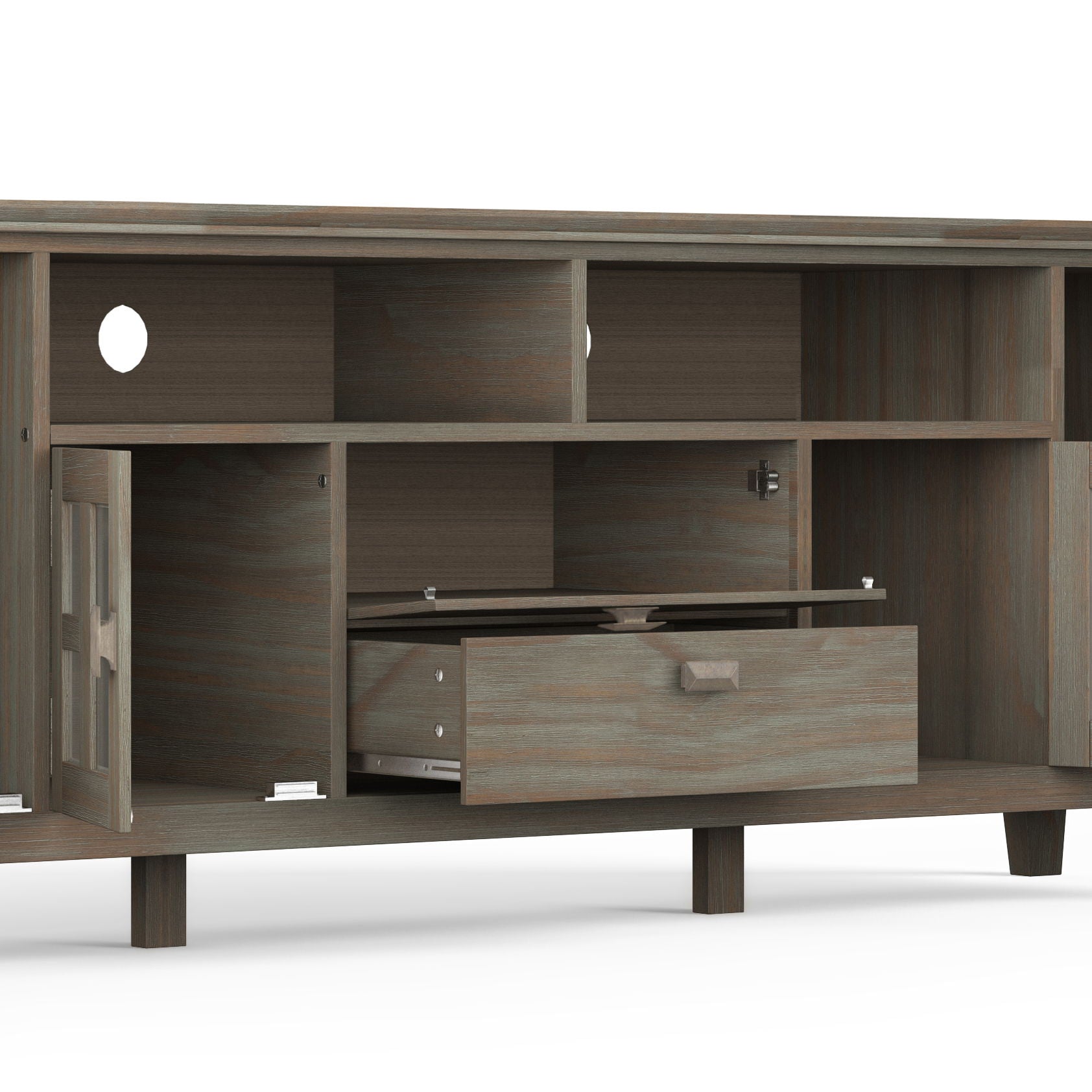 The Artisan - TV Media Stand features open shelves, a left-side cabinet door, a partially open central drawer, and cable management holes on the back. It sits on short legs against a white background.