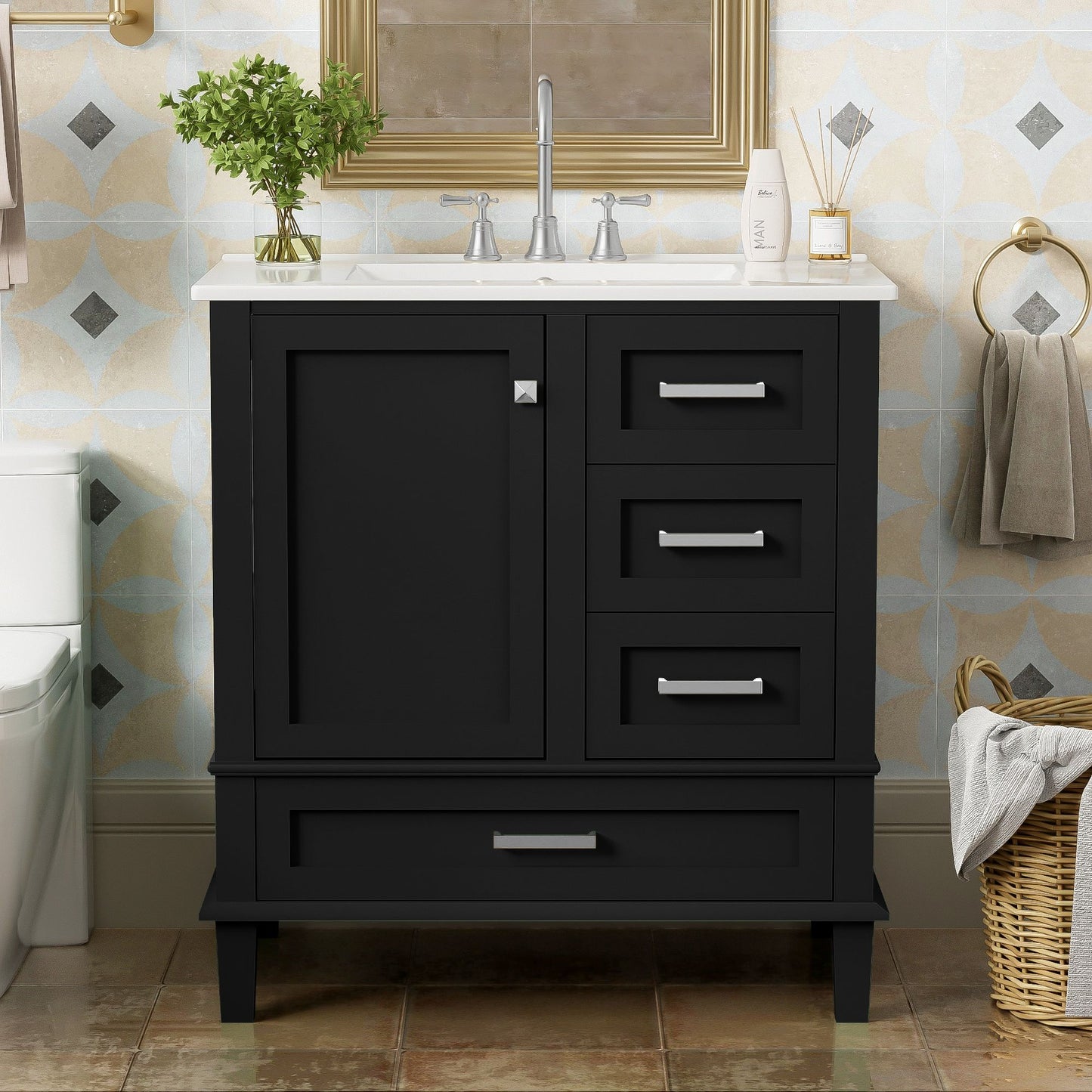 The Modern Bathroom Vanity Combo Set features a solid wood frame, soft closing door, 3 drawers, and a white sink with silver faucets, topped by a mirror. Towels and a wicker laundry basket sit beside it against the tiled wall.