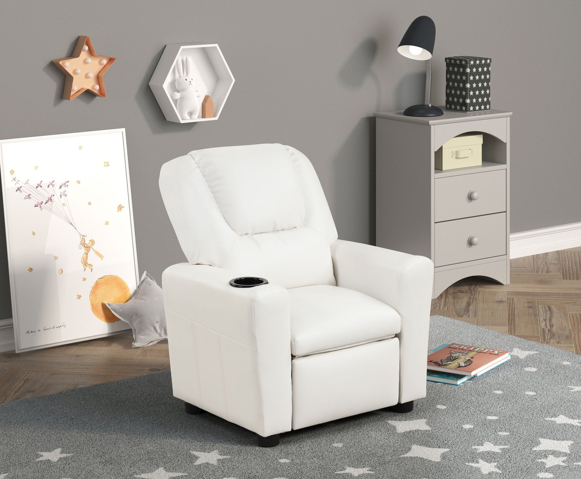 A children's room featuring the Marisa PU Leather Kids Recliner Chair with Cupholder in white, a gray nightstand with a lamp, and star-themed decor like a framed print, wall shelf with bunny, and star rug on wooden flooring.