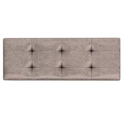 Shay is a large square coffee table storage ottoman in mid-century style, featuring padded upholstery in light grey faux leather with a tufted, grid-like pattern of nine sections.