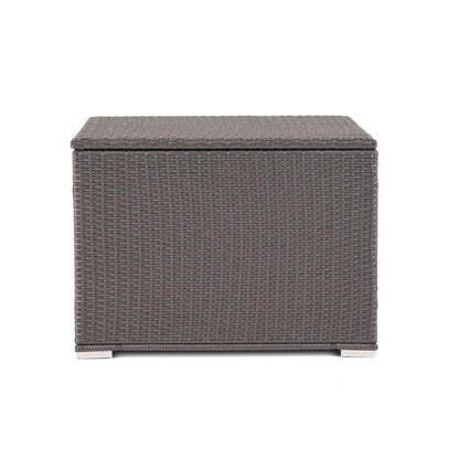 The Santa Rosa - Storage Table is a rectangular outdoor box made of grey woven rattan, featuring a flat lid and short feet, shown against a plain white background.