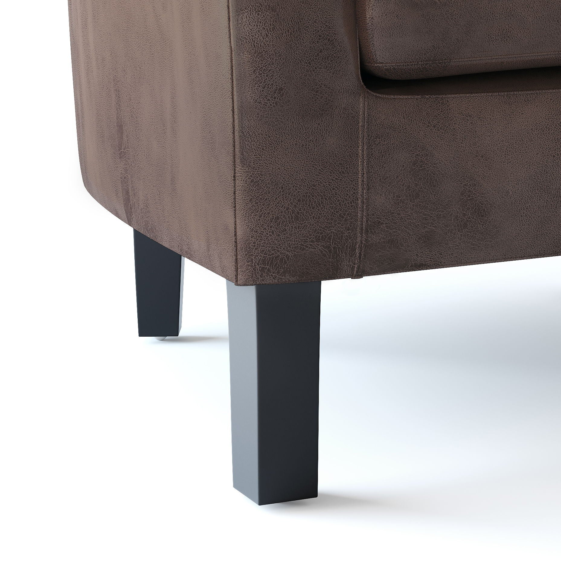 Close-up view of the corner of the Austin - Handcrafted Tub Chair, featuring brown textured upholstery and two black rectangular legs, displayed on a white background.