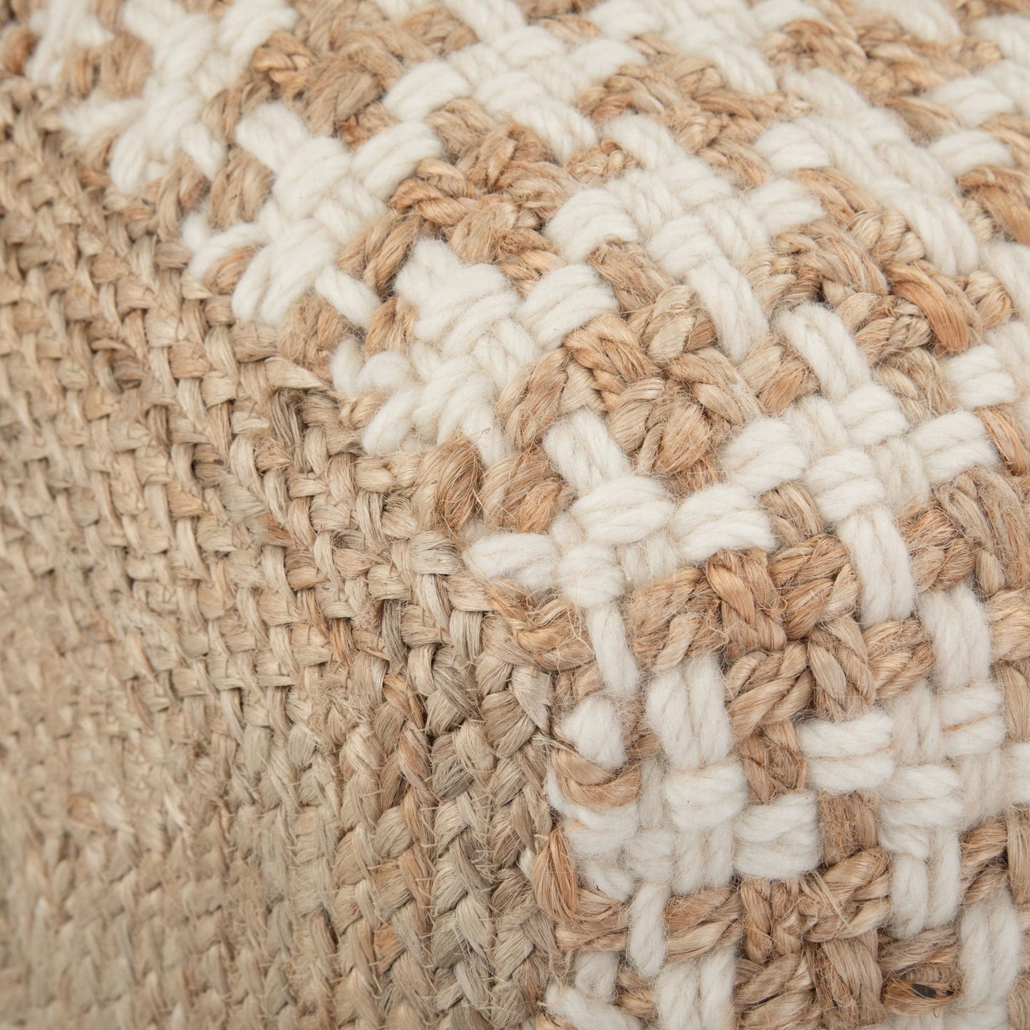 Close-up of the Cullen - Cube Pouf - Natural, showcasing its woven checkerboard pattern with thick beige and white fibers for a textured, rustic look.