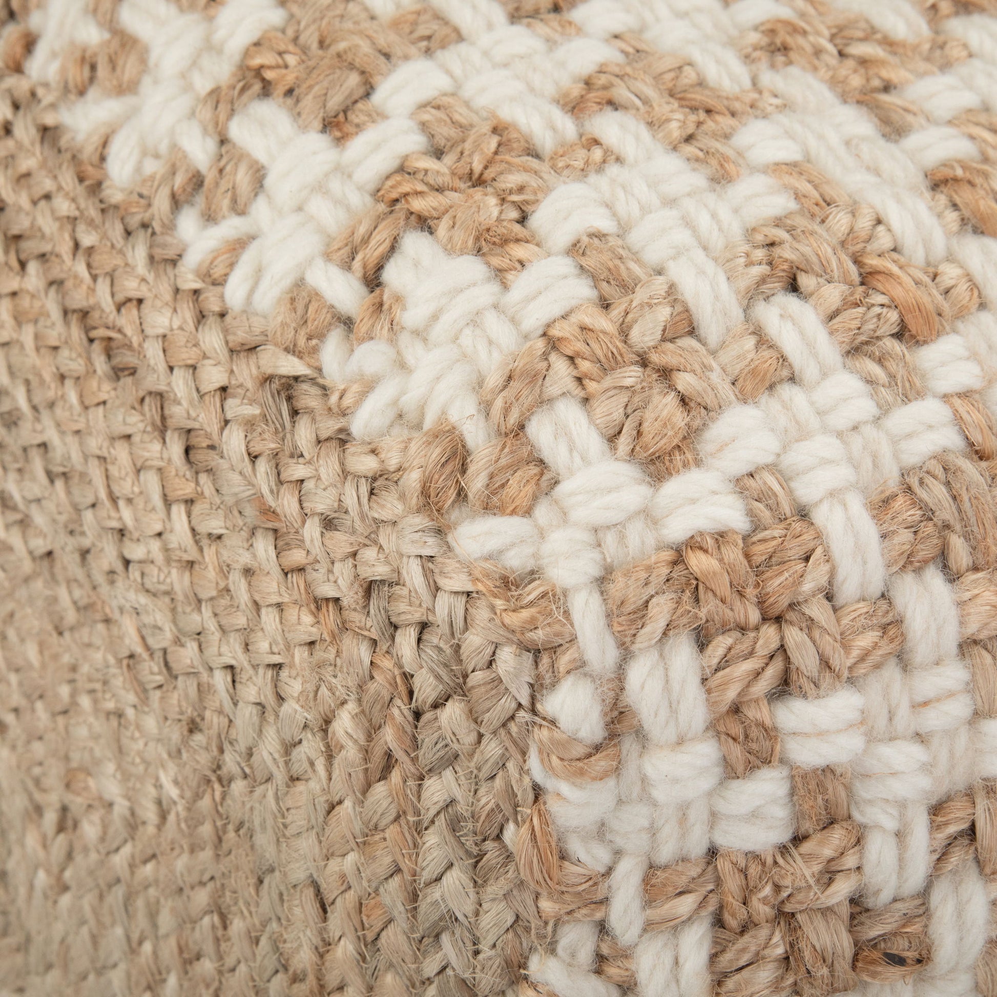 Close-up of the Cullen - Cube Pouf - Natural, showcasing its woven checkerboard pattern with thick beige and white fibers for a textured, rustic look.