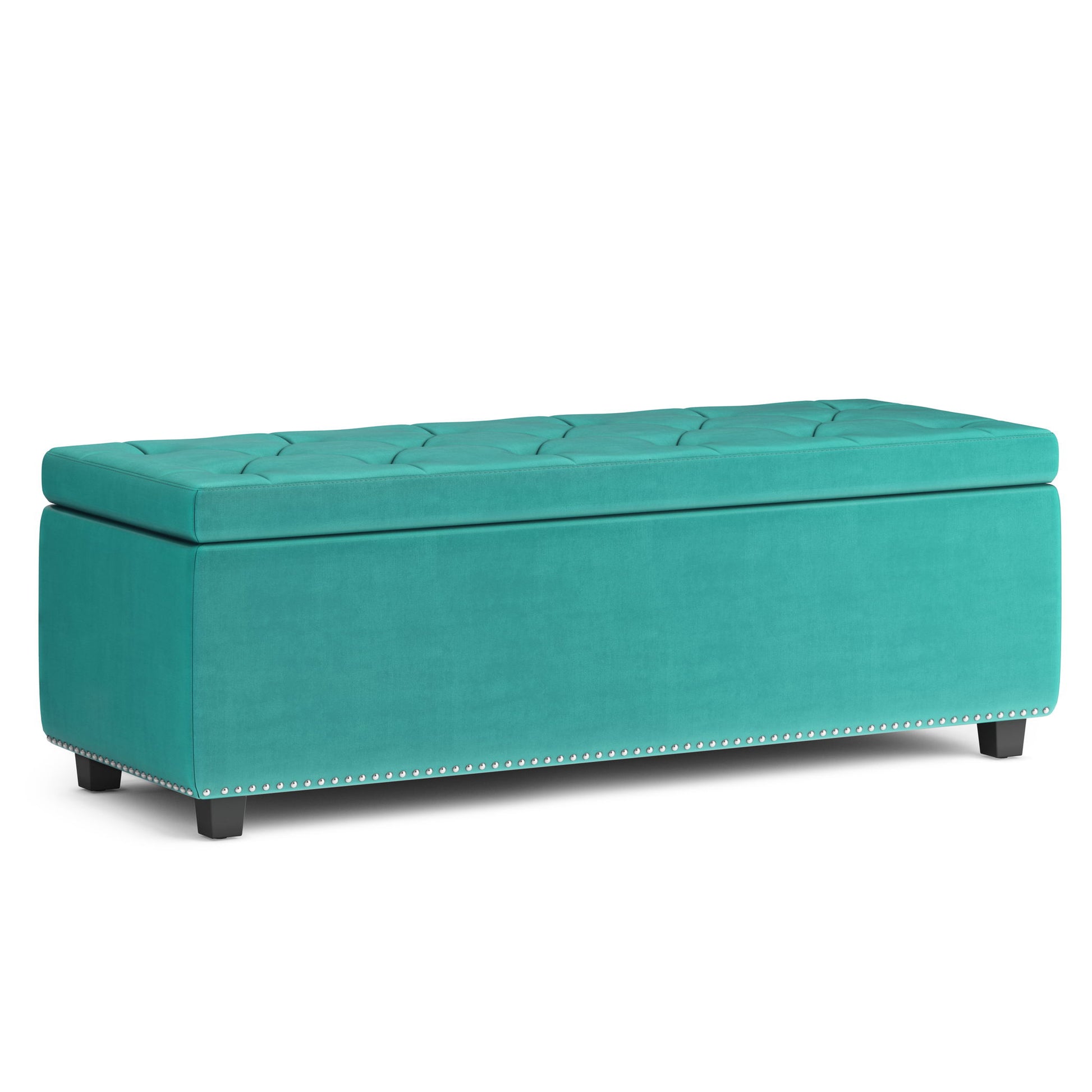 The Hamilton - Upholstered Storage Ottoman features teal upholstery, a tufted lid, short black legs, and decorative silver nailhead trim along the bottom edge.