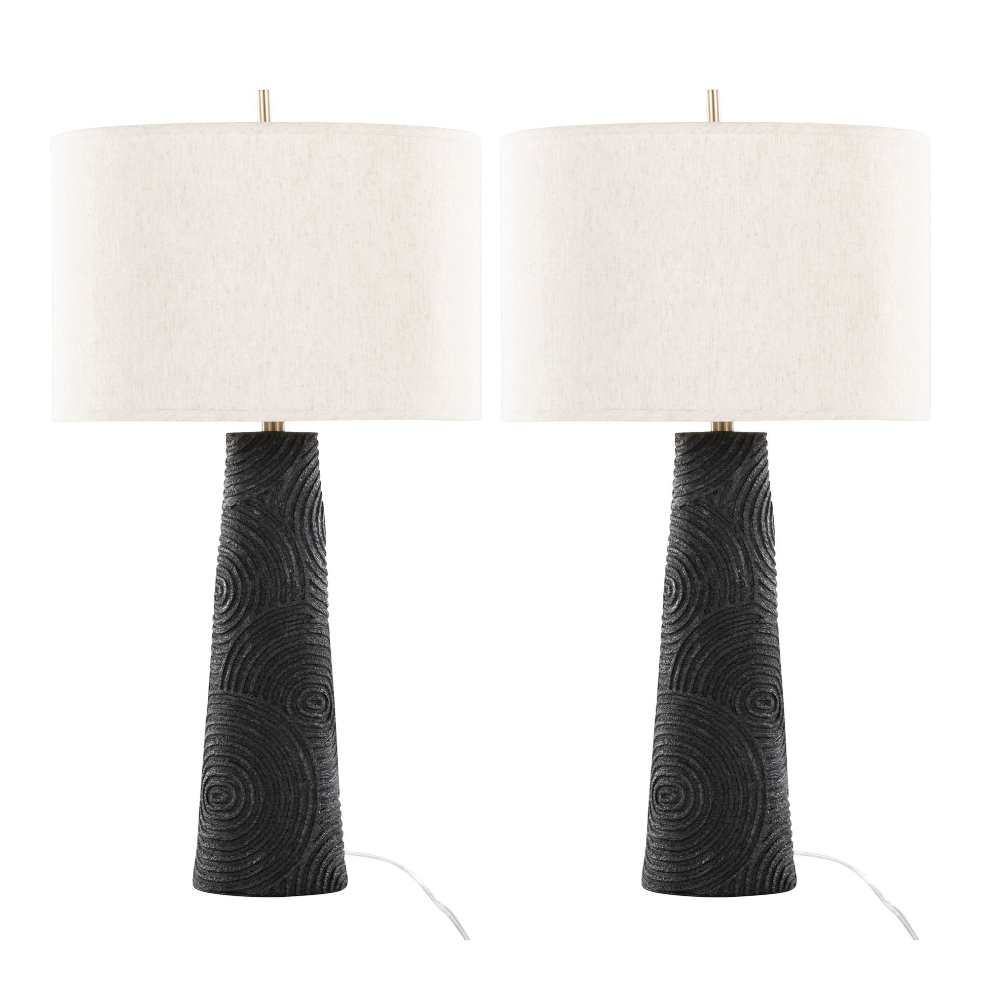 Set of 2 Kona Contemporary Table Lamps with textured matte black bases featuring circular patterns and large white drum lampshades. Visible cords at the base. Finish: Matte Black/Modern Brass/Natural.