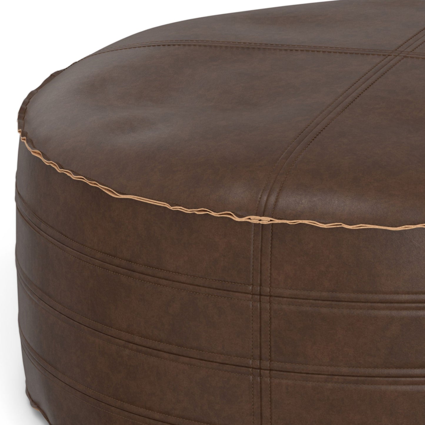 Close-up of the Brody - Round Pouf, featuring brown leather with visible stitching, a slightly wrinkled surface, and light tan piping along the edge.