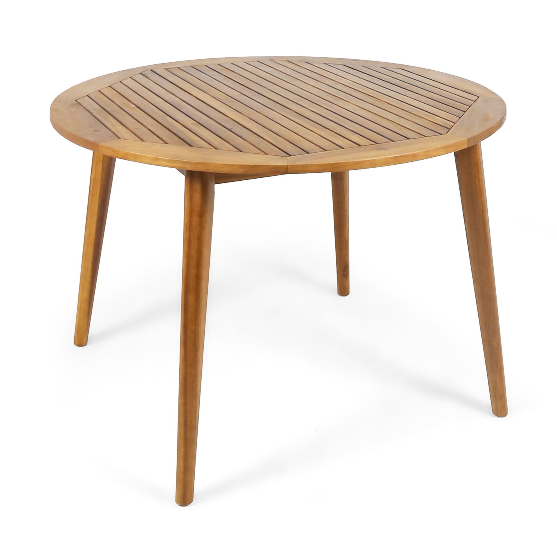 The Stamford - Outdoor Dining Table features a modern round wooden design with four angled legs and a slatted tabletop, displayed against a white background.