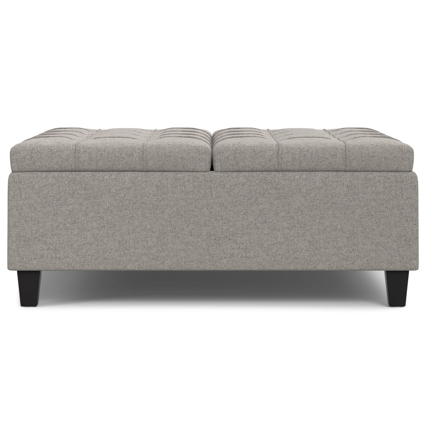Harrison - Upholstered Coffee Table Storage Ottoman features a rectangular, light gray design with a tufted top and short dark wooden legs, displayed against a white background.