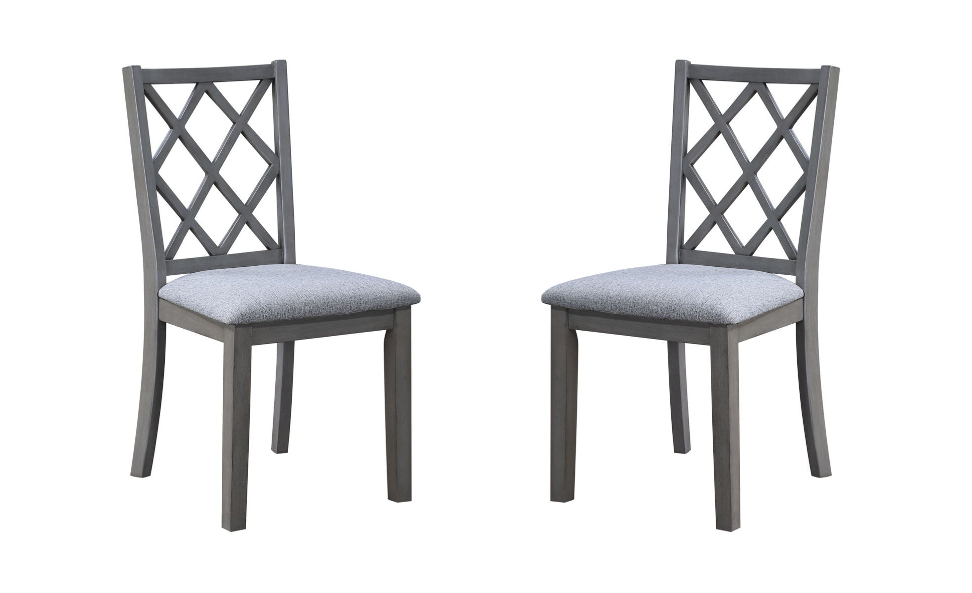 Two Carlisle Cross Back Side Dining Chairs in gray wood with cushioned seats, featuring a crisscross backrest design, are positioned facing each other against a white background.