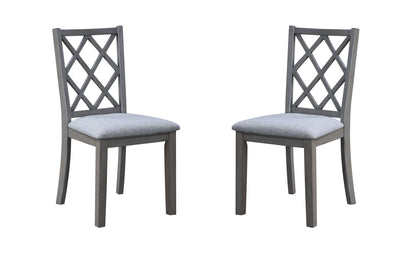 Two Carlisle Cross Back Side Dining Chairs in gray wood with cushioned seats, featuring a crisscross backrest design, are positioned facing each other against a white background.