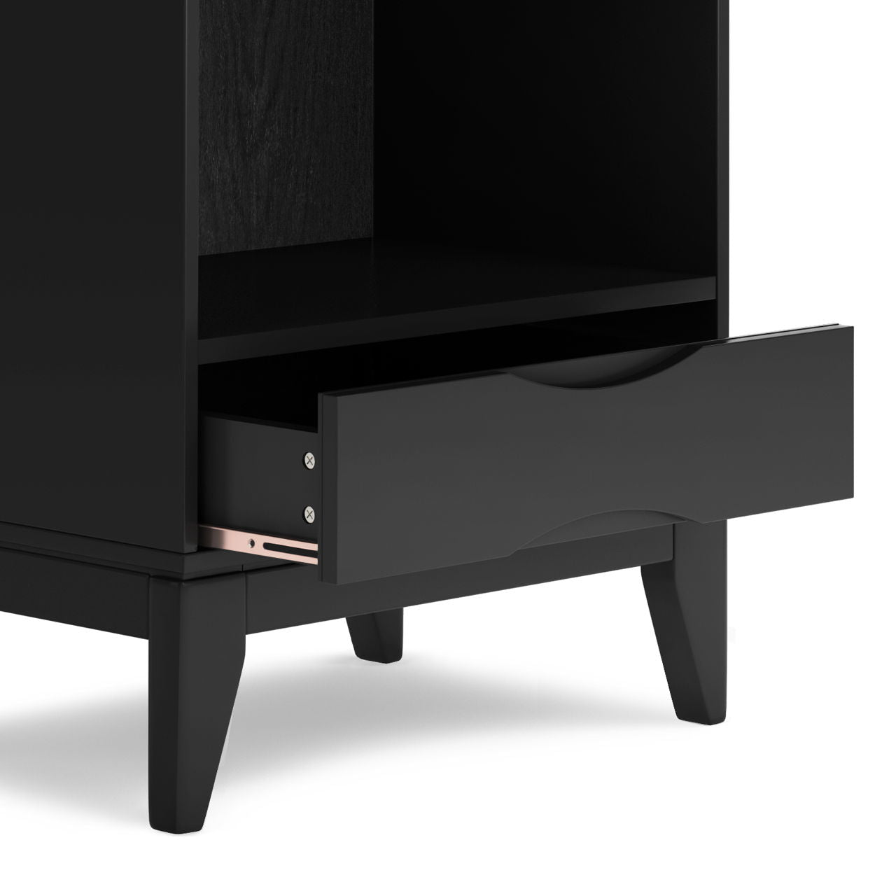 The Harper - Handcrafted Bookcase With Storage features a black wooden design, tapered legs, an open shelf, and a lower drawer that is partially open with a slim laptop stored inside.