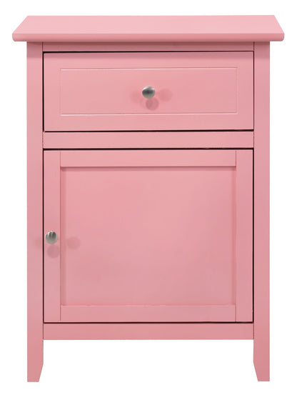 The Izzy - 1 Drawer /1 Door Nightstand is a small pink wooden cabinet with a top drawer and lower door, each with a round silver knob.