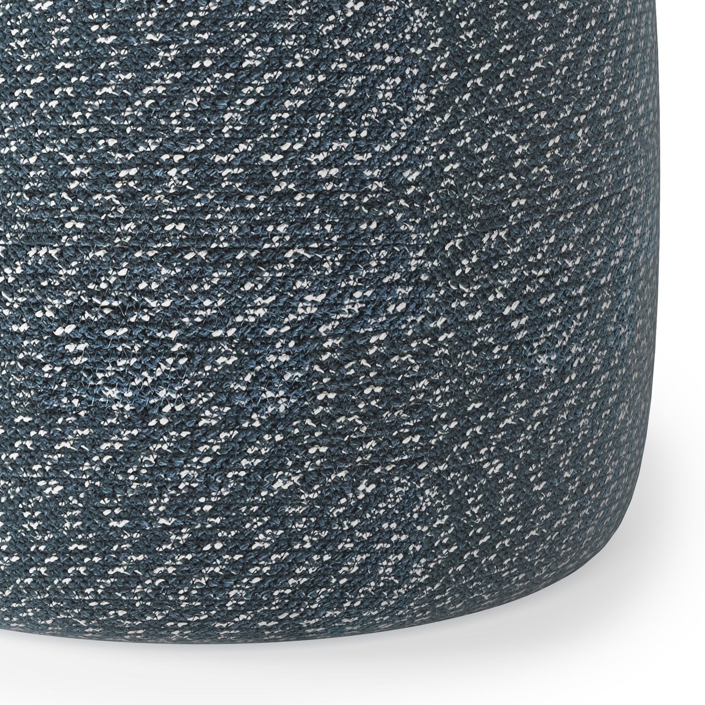Close-up of the Bayley - Versatile Round Braided Pouf, featuring a tightly woven, dark gray and white speckled fabric. The cylindrical surface curves smoothly to the bottom right.