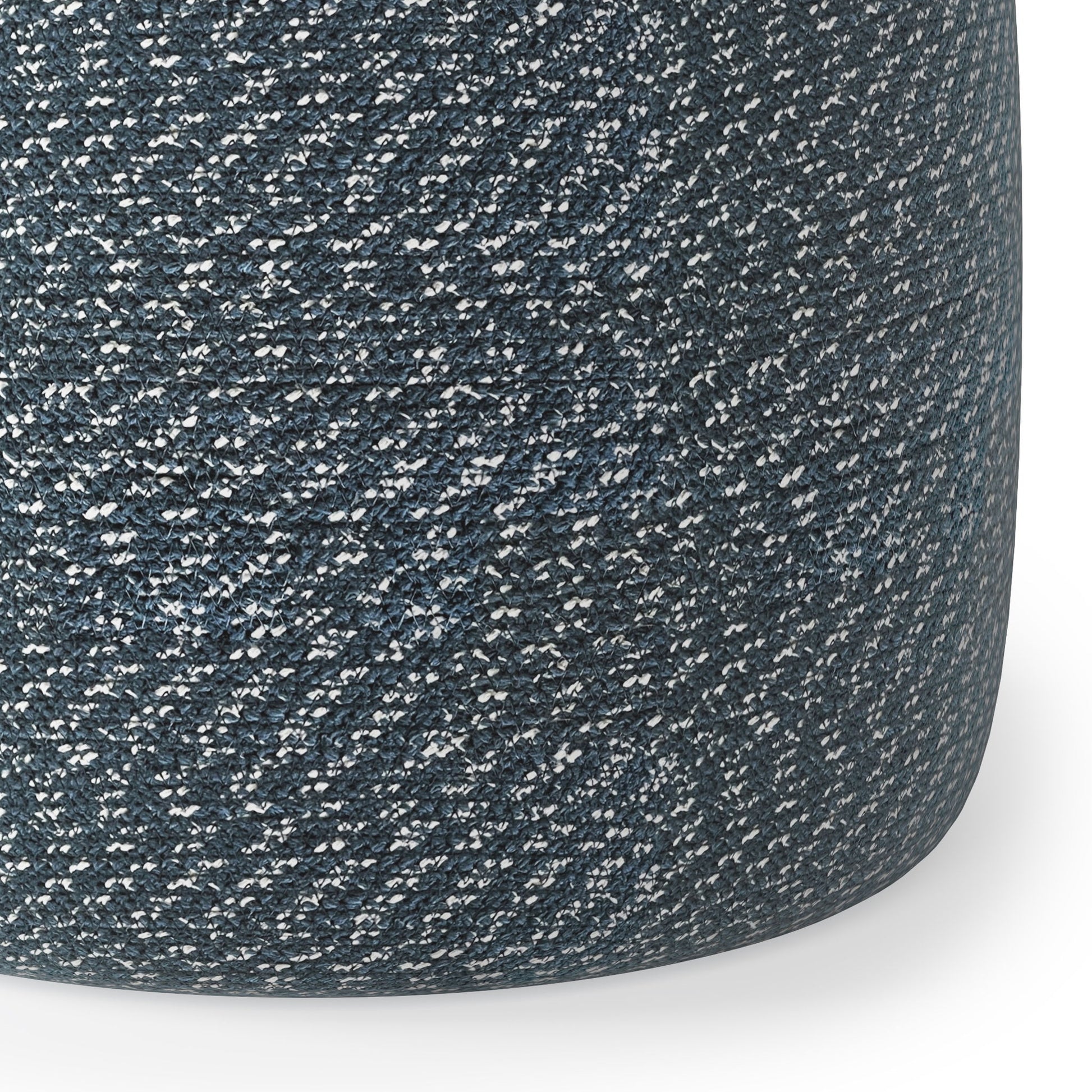 Close-up of the Bayley - Versatile Round Braided Pouf, featuring a tightly woven, dark gray and white speckled fabric. The cylindrical surface curves smoothly to the bottom right.