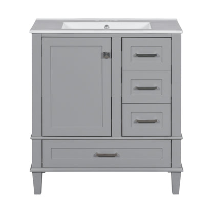 A modern gray bathroom vanity with a white rectangular sink, solid wood frame, soft-closing left cabinet door, three right drawers, and a wide bottom drawer—each featuring silver handles—for ample storage.