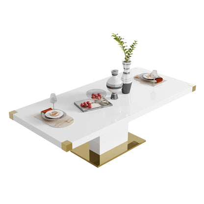 The Top Dining Table With Finish Corner is a modern white rectangular table with gold accents, elegantly set for two with plates, cutlery, glasses, food, and a centerpiece featuring decorative vases and a plant.