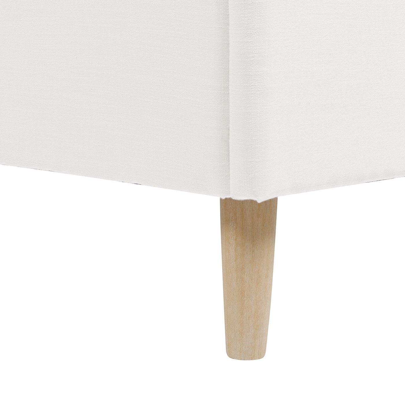Close-up of the Stockholm - Modern Wavy Headboard Platform Bed, highlighting its white upholstered fabric, a single light wood leg, and sleek, straight lines.