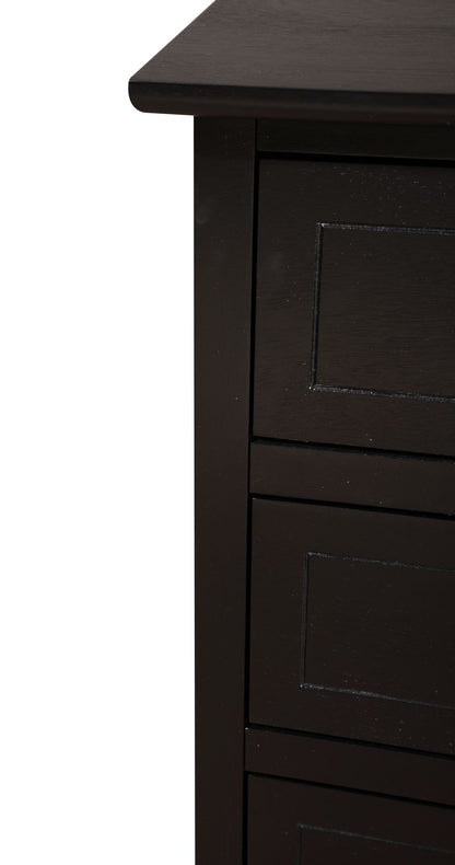 Close-up of the top corner and side of the Daniel - 3 Drawer Nightstand, featuring dark wood, visible edges, and part of three rectangular drawer fronts with simple panel detailing.