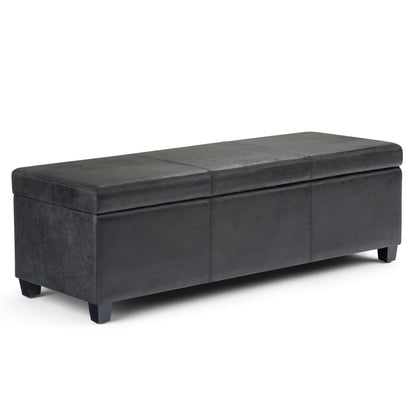 The Avalon - Storage Ottoman Bench in distressed black features a rectangular upholstered design, hinged lid, and short sturdy legs, shown against a white background.