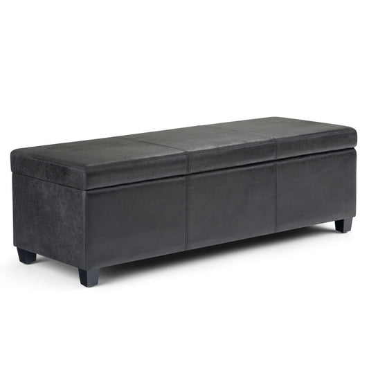 The Avalon - Storage Ottoman Bench in distressed black features a rectangular upholstered design, hinged lid, and short sturdy legs, shown against a white background.