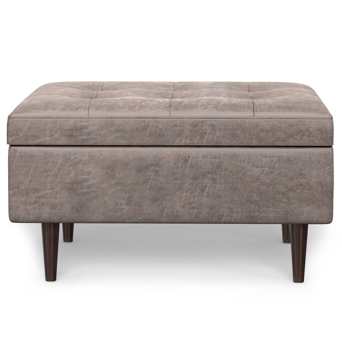 The Shay Large Square Coffee Table Storage Ottoman features a tufted light brown upholstery and short dark wooden legs in mid-century style, shown from the front on a white background.