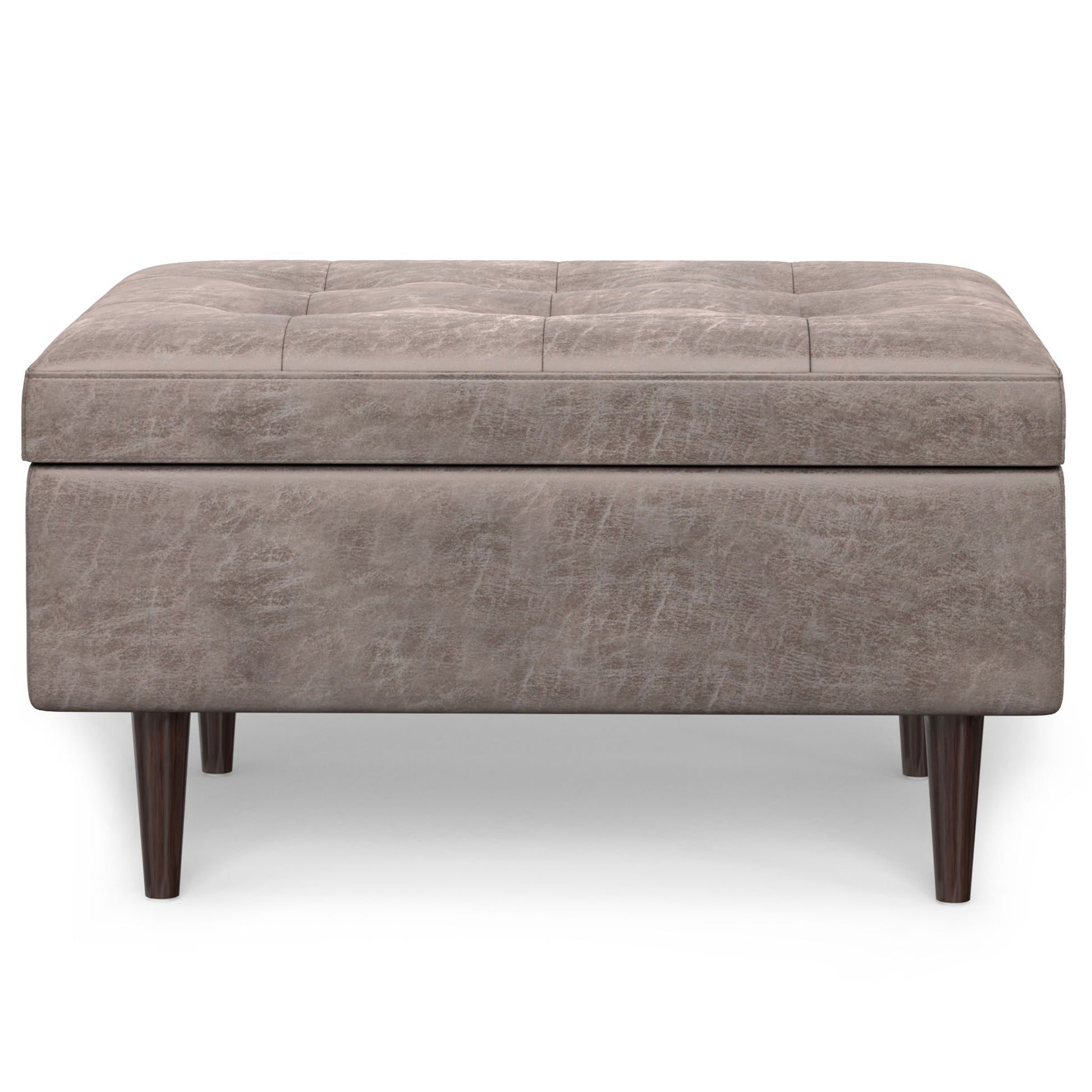 The Shay Large Square Coffee Table Storage Ottoman features a tufted light brown upholstery and short dark wooden legs in mid-century style, shown from the front on a white background.