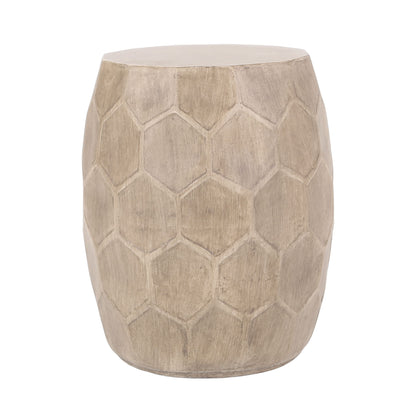 An outdoor side table made from lightweight concrete with a natural finish and a hexagonal, honeycomb-inspired pattern on its rounded sides.