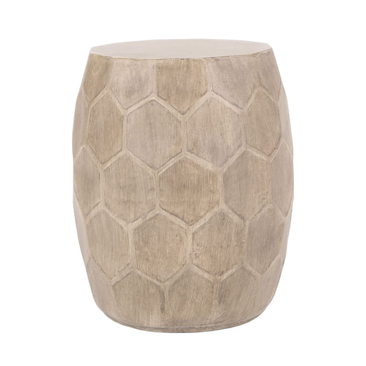 An outdoor side table made from lightweight concrete with a natural finish and a hexagonal, honeycomb-inspired pattern on its rounded sides.