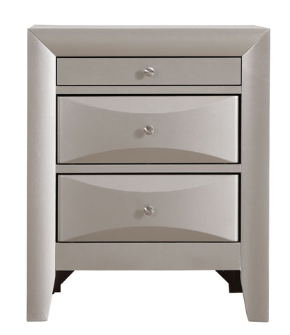 The Marilla Nightstand is a modern, light gray piece with three drawers featuring round silver knobs, a sleek angular design, and short legs.