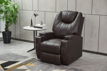 A Modern Recliner Chair With Cup Holders and Remote Control sits beside a round marble side table holding a lamp, books, and decor. A potted plant and part of a patterned rug are visible in the stylish room.