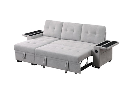 The Ashlyn II 84"W woven fabric reversible sleeper sectional sofa features light gray upholstery, tufted design, an extended storage chaise, built-in cup holders, and armrest compartments. Shown here in its unfolded bed position.