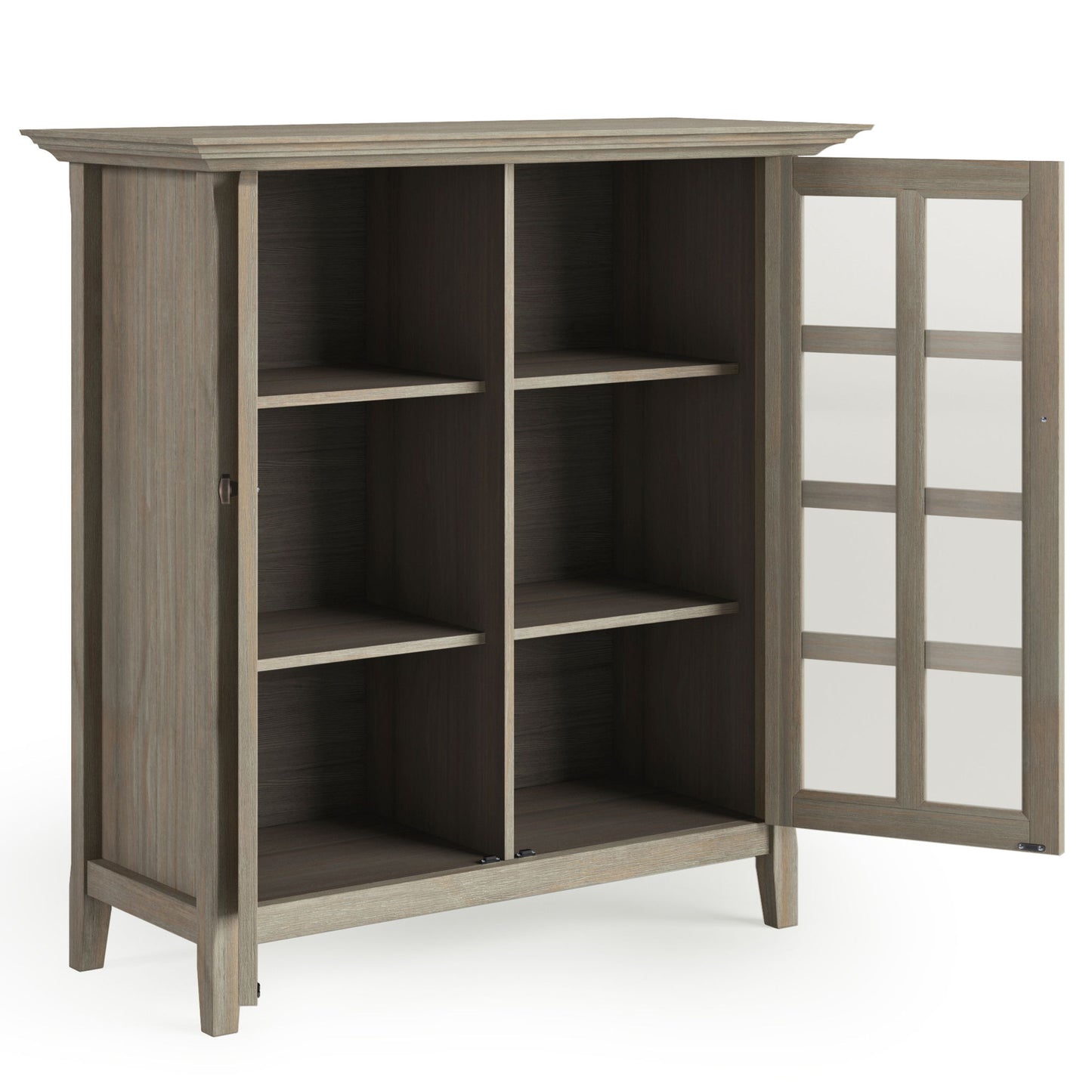 The Acadian - Medium Storage Cabinet, Handcrafted, features four shelves and a glass-paned door. It stands on four short legs and showcases a natural wood finish, offering stylish interior storage compartments.