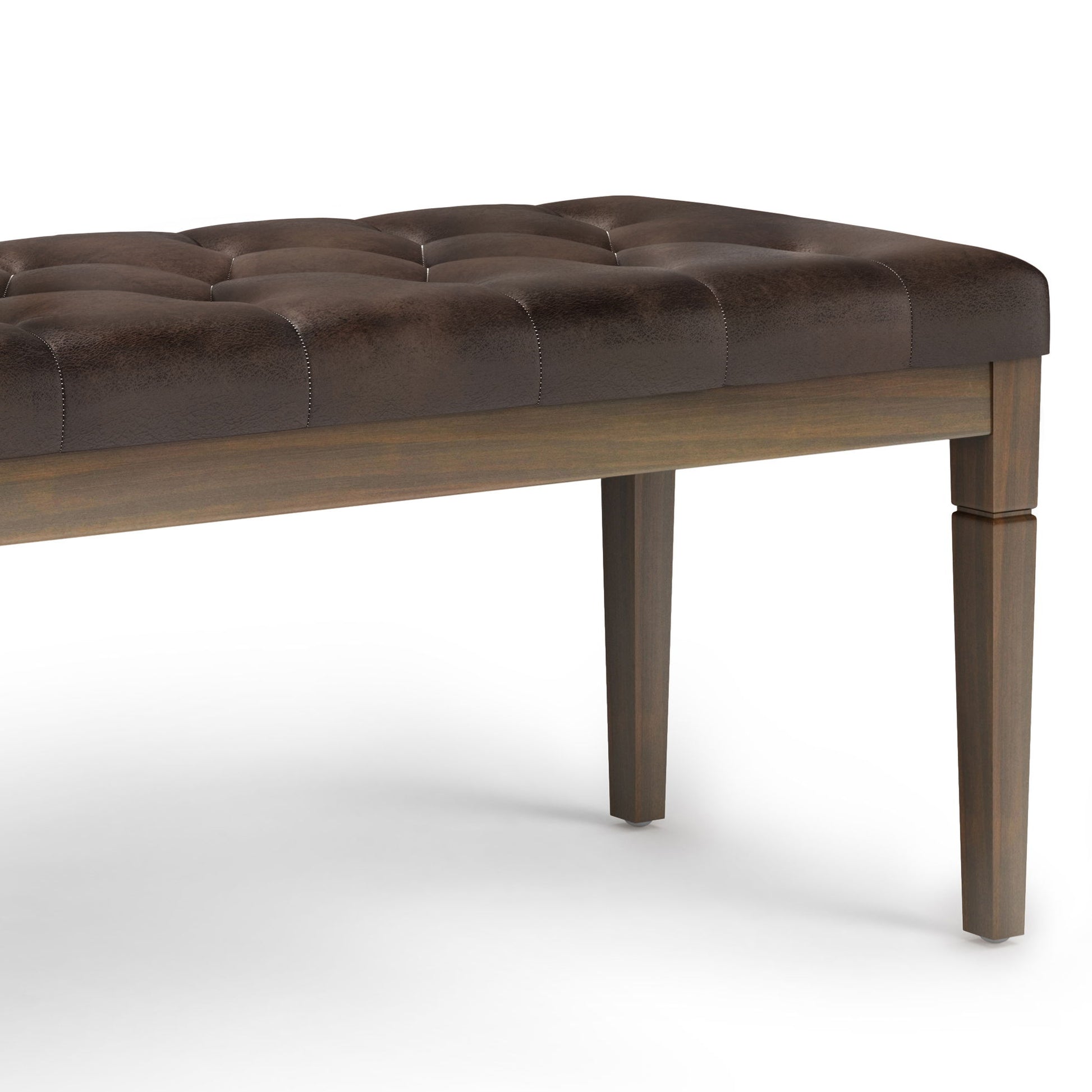 The Waverly - Upholstered Tufted Ottoman Bench features a dark brown tufted cushion and four straight wooden legs, shown close-up on a white background.