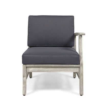 The Perla - Armchair features a wooden frame in light gray, dark gray cushions, and a single right-side armrest. Displayed from the front against a white background.