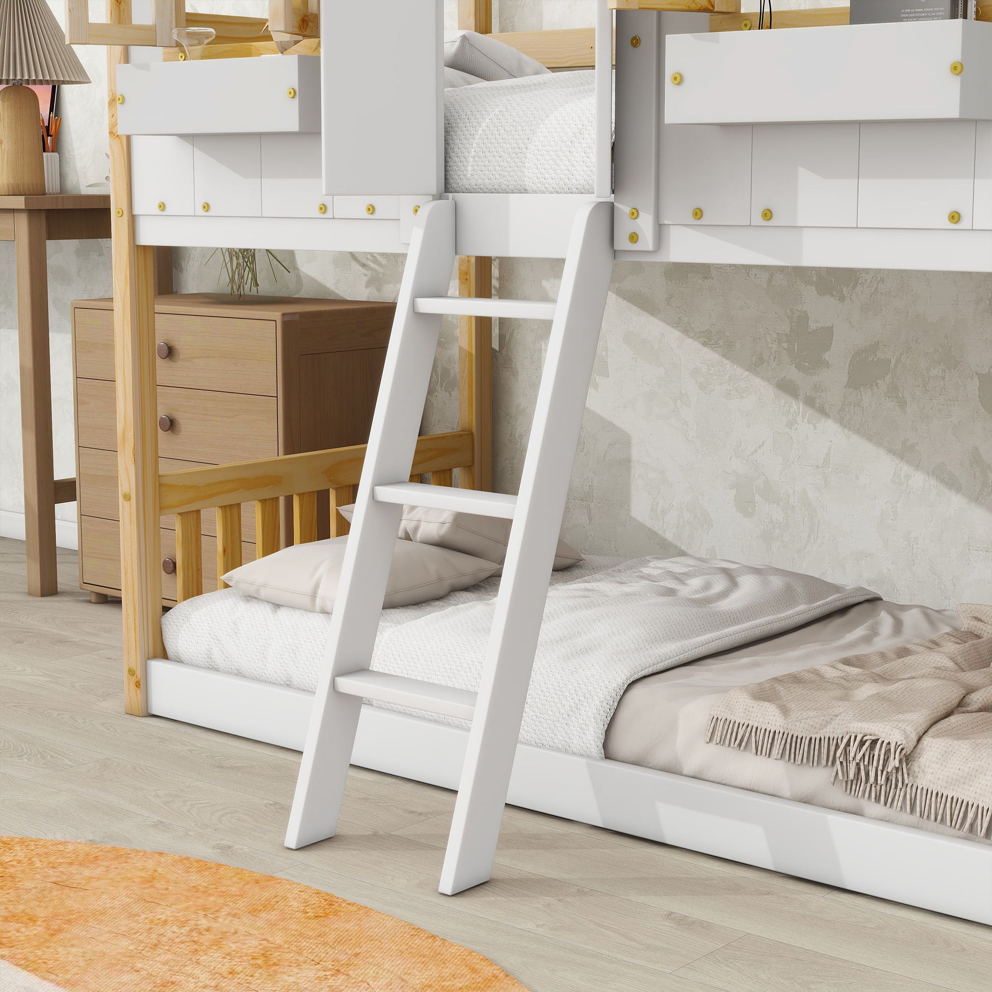 A white ladder leads to the top bunk of the House Bunk Bed With Roof, Window, Window Box, Door, Safety Guardrails and Ladder; a wooden nightstand with drawers and a lamp sits nearby on a light wood floor.