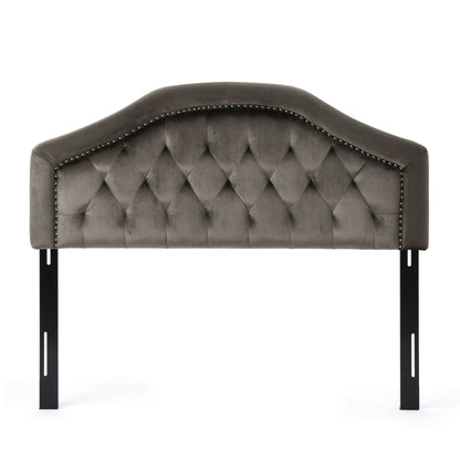 The Kaarina - Contemporary Tufted Fabric Headboard features gray upholstery, a curved top, diamond tufted design, nailhead trim along the edge, and is supported by two black metal legs.